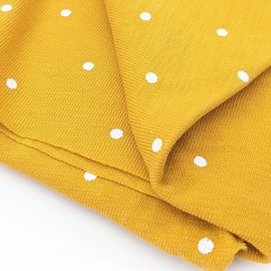 Destock 0.73m tissu jersey coton moutarde pois blanc largeur 135cm 