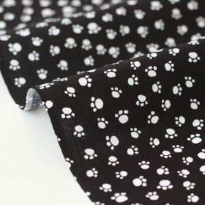 Tissu américain patchwork les empreintes fond noir x 50cm 