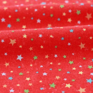 Tissu américain patchwork-étoiles fond rouge x 50cm 