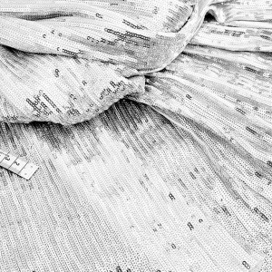 Destock 1.5m tissu sequins brodés sur jersey lycra argenté lourd fluide largeur 155cm