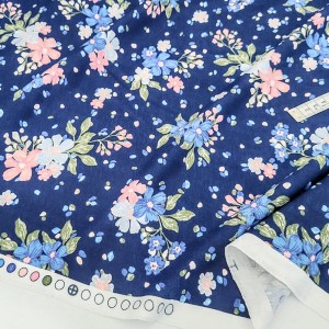 Destock 1m tissu jersey coton imprimé fleuri fond bleu largeur 178cm