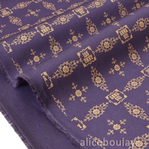Tissu américain gabardine coton vintage doré fond violet x 50cm 