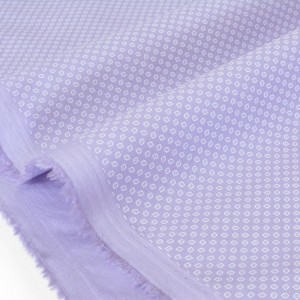 Tissu popeline coton petit motif géométrique blanc fond parme x 50cm 