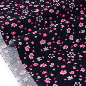 Tissu velours milleraies extra doux fleuri rose sur fond noir x 50cm 